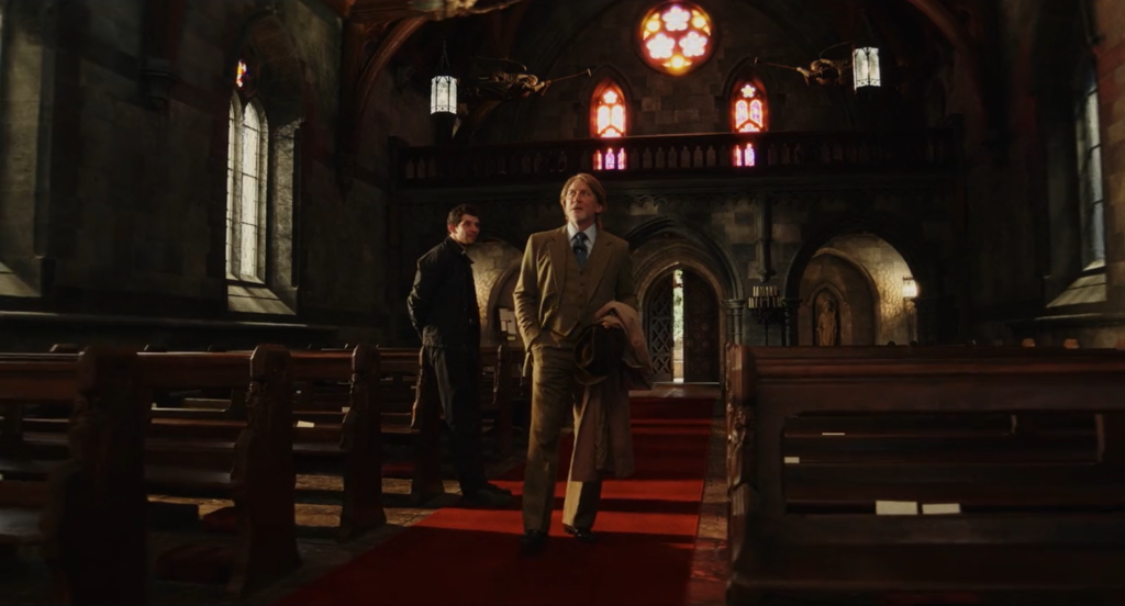 An image of Father Jud and Benoit Blanc meeting for the first time.