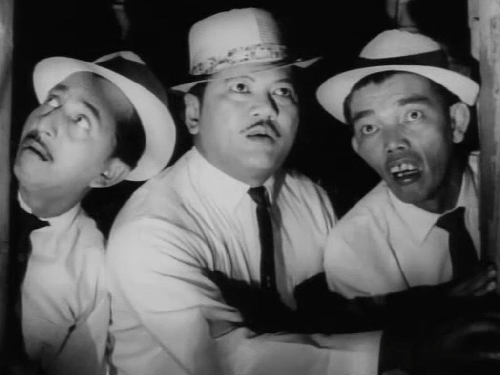 Gambar P. Ramlee bersama dua aktor lain dalam film Do Re Mi