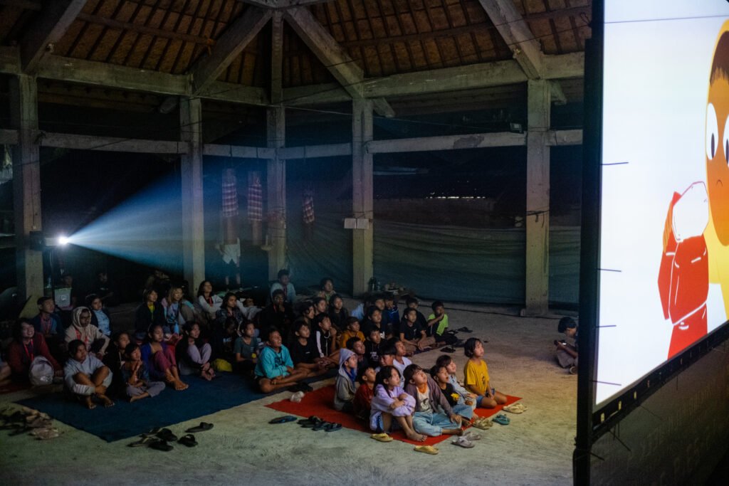 Small Rooms, Short Films, Long Routes Children watching film in a village hall